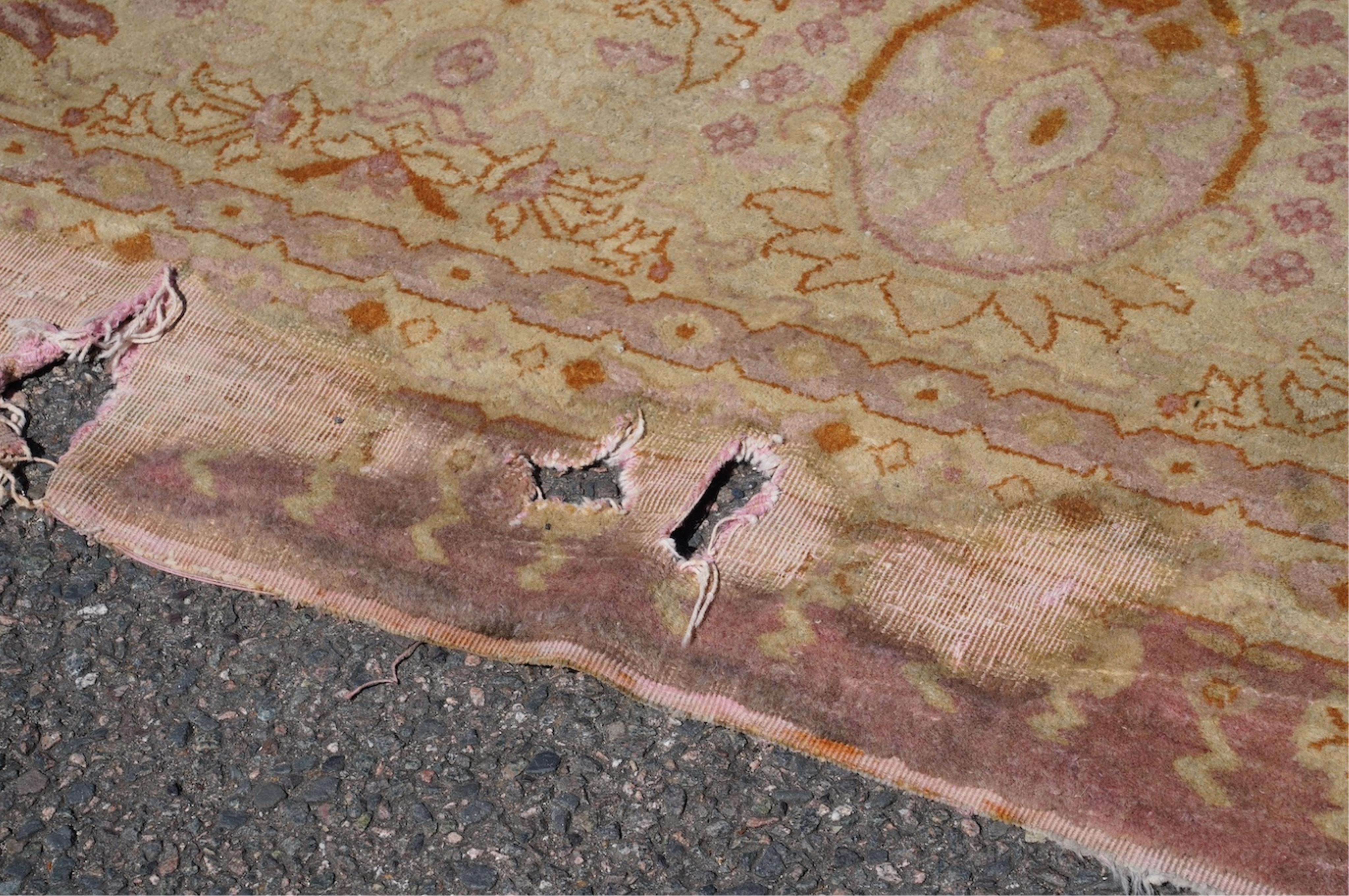 An Amritsar carpet, approximately 580 x 395cm. Condition - fair